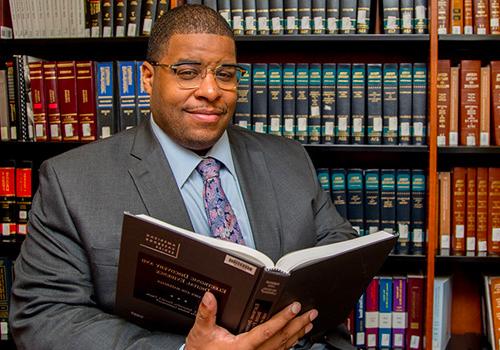 Law student holding a book